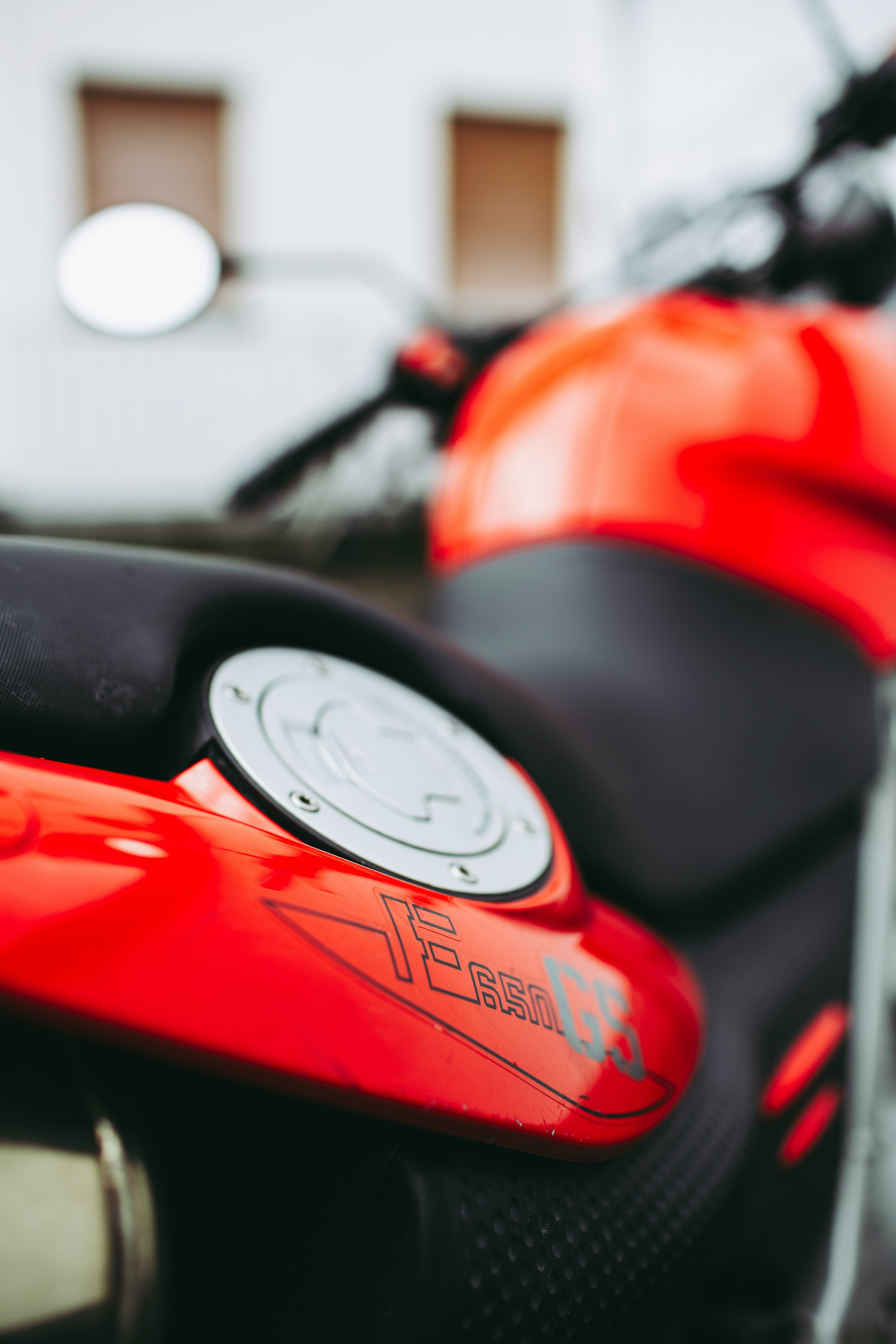 red and black motorcycle in close up photography
